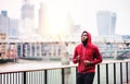 Young sporty black man runner running on the bridge outside in a city. Royalty Free Stock Photo