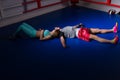 Young sporty boxing couple in sportswear lying and resting after
