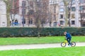 Young sporty boy rides a bicycle on Paris street