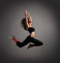 A young and sporty brunette woman in a jump Royalty Free Stock Photo
