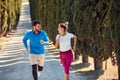 Sporty couple jogging together outdoors Royalty Free Stock Photo