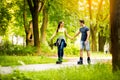 Young sporty couple ride rollerblades Royalty Free Stock Photo