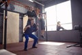 Young sporty couple working out together at gym Royalty Free Stock Photo