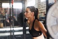 Young sporty female working out at gym Royalty Free Stock Photo