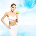 Young, sporty, fit and beautiful girl with an apple Royalty Free Stock Photo