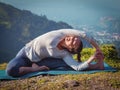 Young sporty fit woman doing Hatha Yoga asana