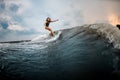 Young girl glides on a wakeboard in the river near forest Royalty Free Stock Photo