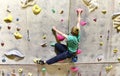 Young sporty man bouldering in a climbing hall - indoor sports Royalty Free Stock Photo