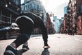 Young sporty man prepearing to start on urban running through on New York streets