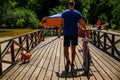 Young Sporty Man Walking His Dog In Park. Royalty Free Stock Photo