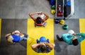 Young sporty people working out together with kettle bells in a gym. Royalty Free Stock Photo