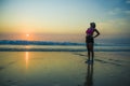 Young sporty and tired African American runner woman cooling off breathing exhausted after running workout at beautiful beach suns Royalty Free Stock Photo