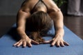 Young sporty woman in Balasana pose, close up view Royalty Free Stock Photo