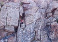 Young Sporty Woman Climbing on mountain cliff with beautiful landscape on background. Healthy lifestyle. Active extreme Royalty Free Stock Photo