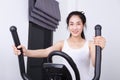 Sporty woman doing exercises with elliptical trainer Royalty Free Stock Photo