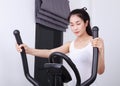 Sporty woman doing exercises with elliptical trainer Royalty Free Stock Photo