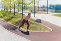 Young Sporty woman doing stretching exercise promenade. Royalty Free Stock Photo