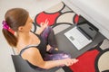 Young sporty woman is doing training  yoga ion line with modern laptop screen Royalty Free Stock Photo