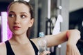 Young sporty woman drinking water in a gym Royalty Free Stock Photo