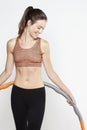 Young sporty woman exercising with a hula hoop Royalty Free Stock Photo