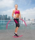 Young sporty woman with hula hoop Royalty Free Stock Photo