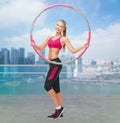 Young sporty woman with hula hoop Royalty Free Stock Photo