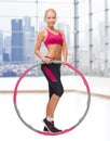 Young sporty woman with hula hoop Royalty Free Stock Photo