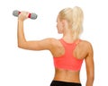 Young sporty woman with light dumbbell Royalty Free Stock Photo