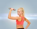 Young sporty woman with light dumbbell Royalty Free Stock Photo