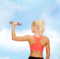 Young sporty woman with light dumbbell Royalty Free Stock Photo