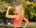 Young sporty woman with light dumbbell Royalty Free Stock Photo