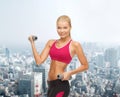 Young sporty woman with light dumbbells Royalty Free Stock Photo