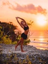 Yoga woman practicing stretch at sunset time Royalty Free Stock Photo