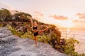 Young sporty woman practicing yoga at colorful sunset time Royalty Free Stock Photo