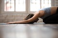 Young sporty woman practicing yoga, doing Child exercise, Balasa Royalty Free Stock Photo