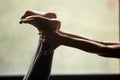 Young sporty woman doing foot and ankle strengthening exercises