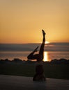 Young sporty woman practicing yoga, doing headstand exercise Royalty Free Stock Photo