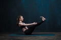 Young sporty woman practicing yoga indoors Royalty Free Stock Photo