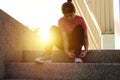 Young sporty woman preparing to run in early foggy morning in the beautiful city Royalty Free Stock Photo