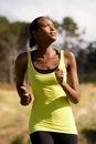 Young sporty woman running outdoors in the park Royalty Free Stock Photo