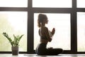 Young sporty woman sitting in Half Lotus pose Royalty Free Stock Photo