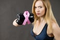 Woman wearing boxing gloves having pink ribbon Royalty Free Stock Photo