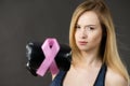 Woman wearing boxing gloves having pink ribbon Royalty Free Stock Photo