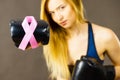 Woman wearing boxing gloves having pink ribbon Royalty Free Stock Photo