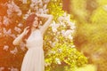 Young spring fashion woman in spring garden. Springtime. Trendy Royalty Free Stock Photo