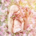 Young spring fashion woman in spring garden. Springtime. Trendy Royalty Free Stock Photo