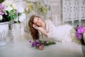 Young spring fashion woman in spring lux vintage interior. Springtime. Trendy girl on a luxury spring background. Allergic to pol Royalty Free Stock Photo