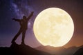 Young standing on mountain and watching the moon.Celebrate Mid autumn festival Royalty Free Stock Photo