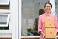 Start up small business owner holding parcel box at workplace. f Royalty Free Stock Photo