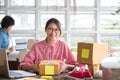 Start up small business owner packing cardboard box at workplace Royalty Free Stock Photo